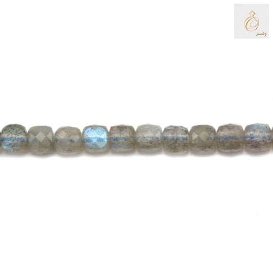 Close-up of 4mm labradorite cube beads displaying natural color variations
