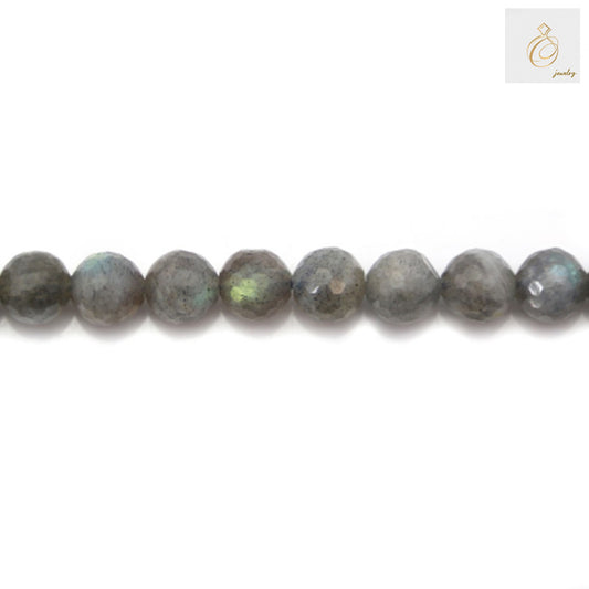 Close-up view of labradorite beads displaying natural stone patterns and faceted surface