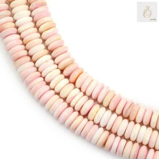 Close-up view of pink Lambi shell heishi beads showing natural color variations and disc shape, 39-40cm strand length