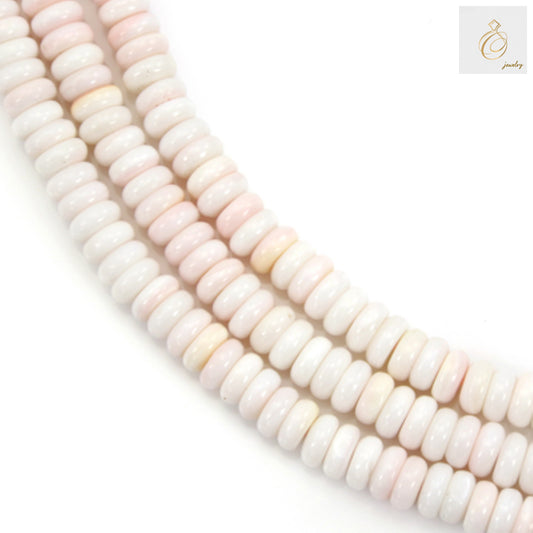 Close-up view of pink lambi shell heishi beads 2x5mm displaying smooth finish and uniform size