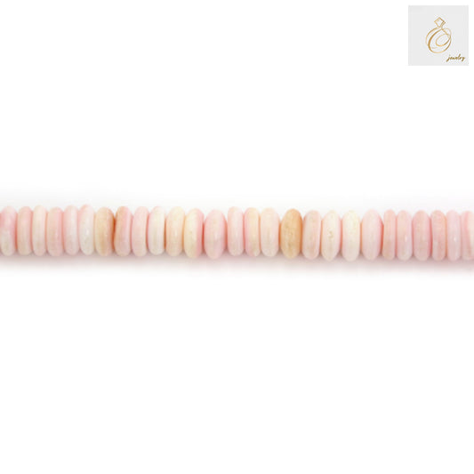 Pink Lambi shell heishi beads 3x6mm size arranged on strand showing natural shell texture and color