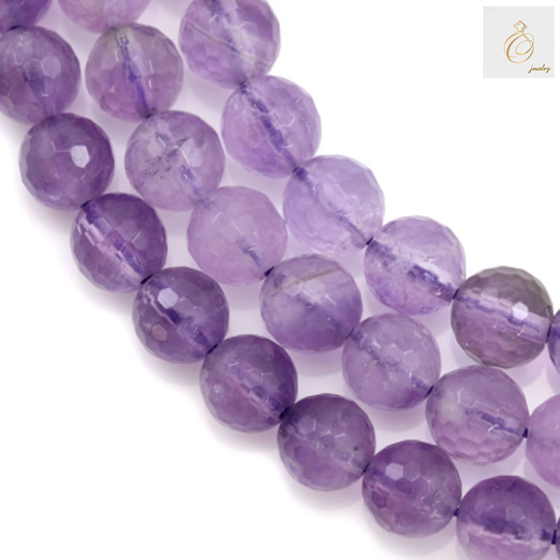 Light amethyst faceted round beads 8mm scattered display showing natural transparency and faceted brilliance