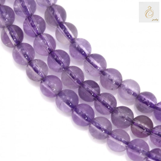 Natural light amethyst round beads 4mm size displayed on strand, showing translucent purple gemstone beads with smooth polished finish