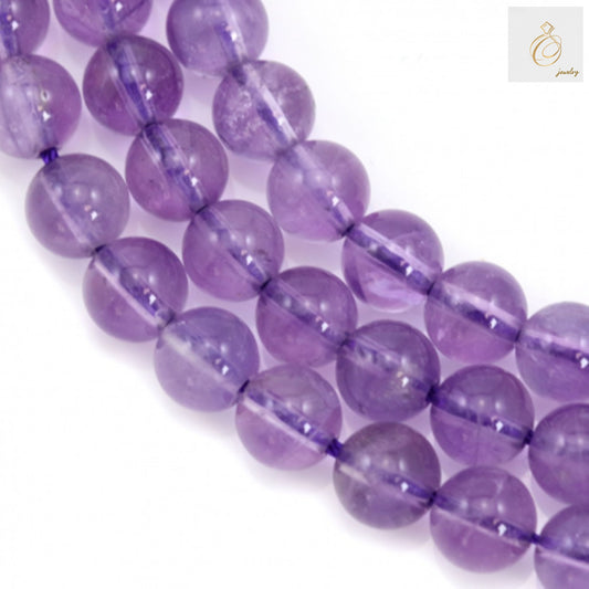 Natural light amethyst round beads 6mm on 39-40cm strand showing beautiful lavender purple color and smooth polished finish