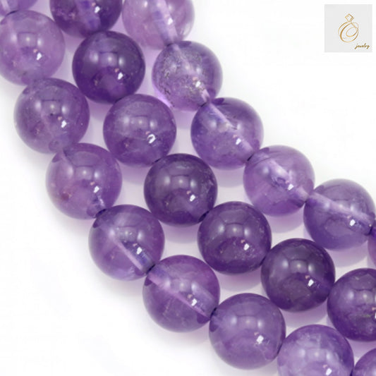Natural light amethyst round beads 8mm diameter arranged in strand, showing purple gemstone clarity and uniform size