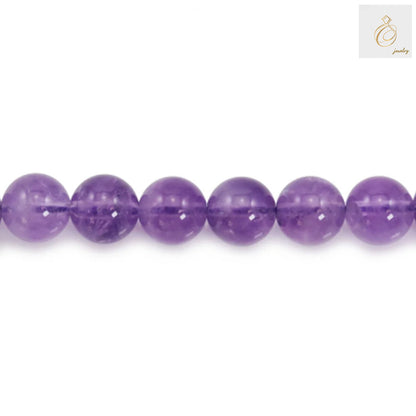 Close-up detail of 10mm light amethyst round beads showing smooth polished finish and lavender color
