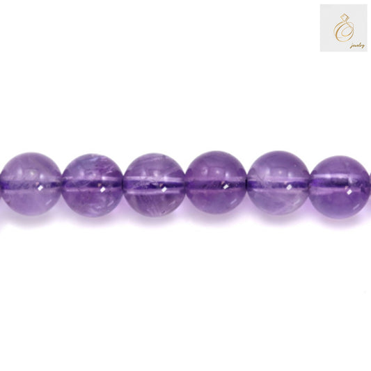 Close-up of 6mm light amethyst round beads highlighting gemstone clarity and uniform lavender color, perfect for jewelry making