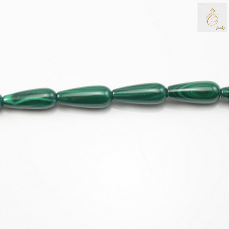 Natural malachite drop beads 7x15mm with green patterns on white background"
"Close-up of malachite gemstone beads showing natural green striations"
"Strand of polished malachite drop beads for jewelry making