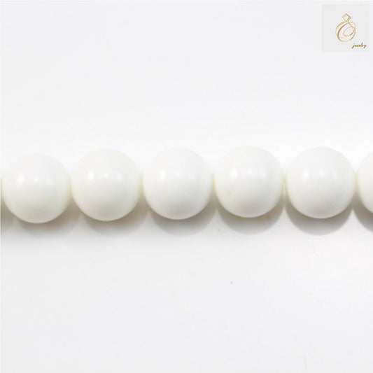 Natural AA grade Tridacna shell round beads, 6mm diameter, white and cream colored strand"
"Close-up of 66 natural Tridacna shell beads showing smooth round shape and natural luster"
"Tridacna shell bead strand for jewelry making, 6mm beads with 1mm holes