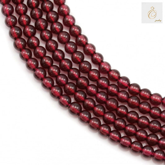 Natural garnet round beads strand, 3mm diameter, deep red gemstone beads for jewelry making"
"Close-up of natural garnet beads showing rich red color and uniform round shape