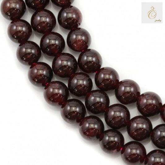 Natural garnet beads strand, 6mm round red gemstone beads for jewelry making"
"Close-up of natural garnet beads showing deep red color and smooth finish"
"Hand holding strand of natural 6mm garnet beads, approximately 63 pieces