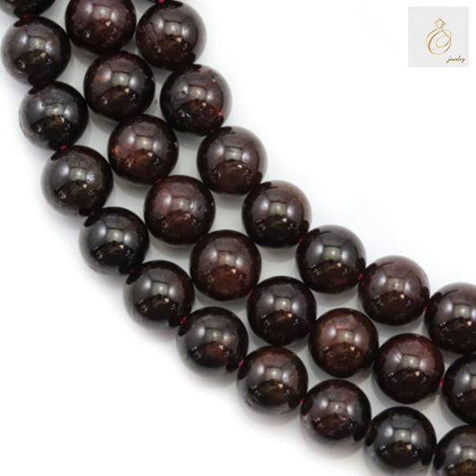 Natural garnet beads strand showing 8mm round red gemstone beads"
"Close-up of natural garnet beads, 8mm diameter with 1mm holes for jewelry making