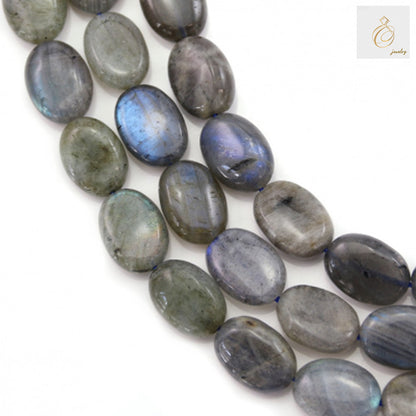 Natural labradorite oval beads 10x14mm showing blue and green flash colors on white background