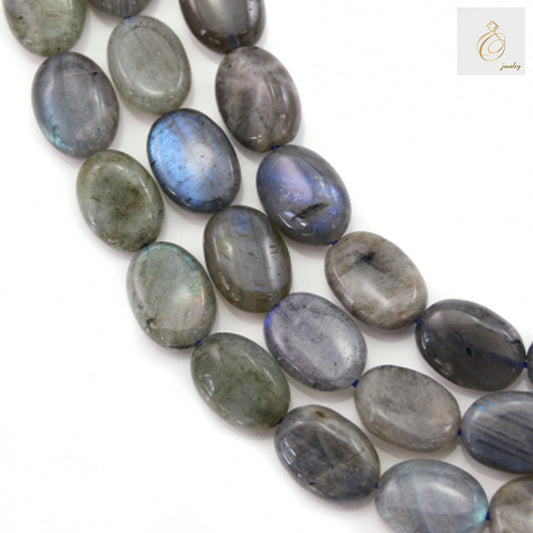 Natural labradorite oval beads 10x14mm showing blue and green flash colors on white background