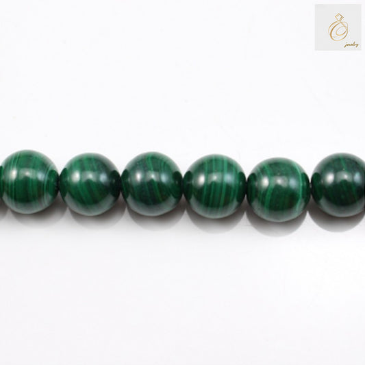 Natural malachite round beads 6mm diameter green gemstone strand"
"Malachite beads strand with 72 pieces for jewelry making"
"Green natural malachite round beads with beautiful banded patterns"
"Premium quality malachite gemstone beads 6mm size for crafting