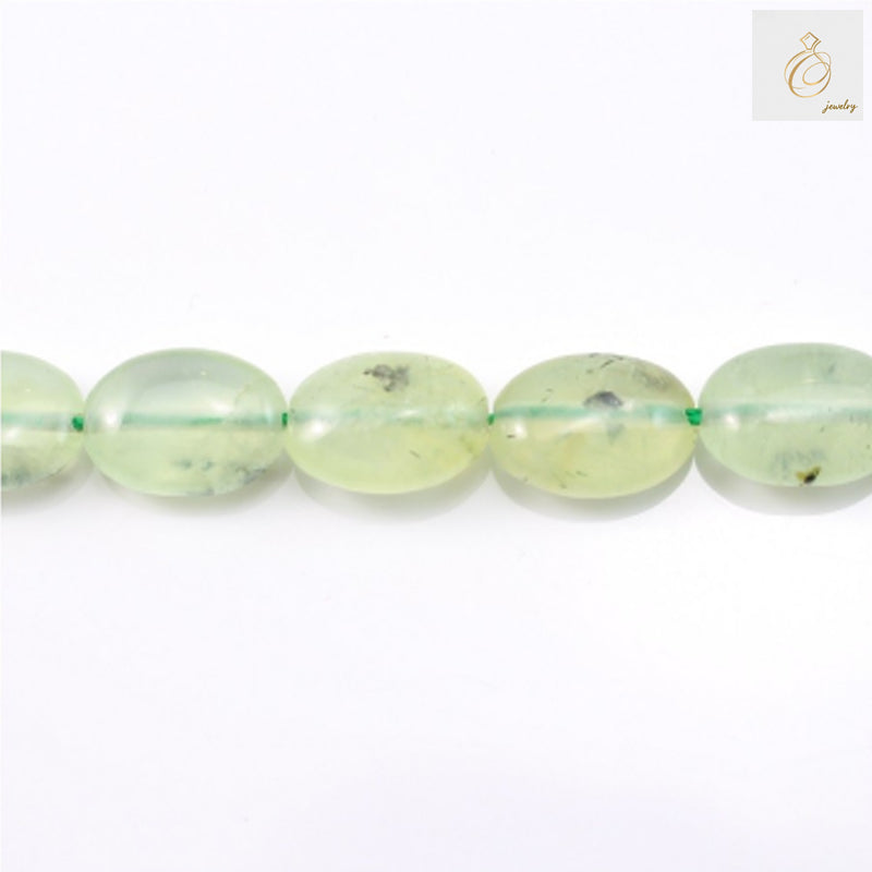 Natural prehnite gemstone beads in oval shape, 10x14mm size, arranged on white background"
"Green prehnite beads strand showing translucent oval gemstones for jewelry making"
"Close-up of natural prehnite oval beads displaying soft green color and smooth finish