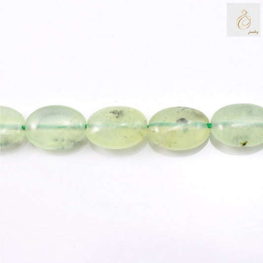 Natural prehnite gemstone beads in oval shape, 10x14mm size, arranged on white background"
"Green prehnite beads strand showing translucent oval gemstones for jewelry making"
"Close-up of natural prehnite oval beads displaying soft green color and smooth finish