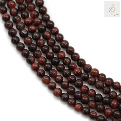 Natural red tiger's eye gemstone beads, 2mm round beads arranged in strands showing rich red color and natural patterns