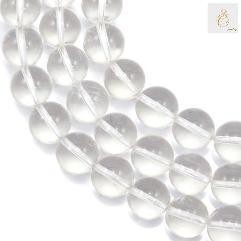 Natural clear rock crystal round beads 14mm diameter arranged in strand for jewelry making