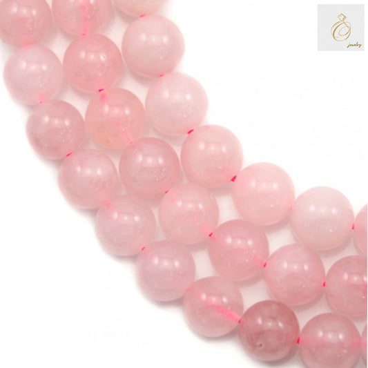 Natural rose quartz beads strand showing 12mm round beads with smooth finish and natural pink color variations