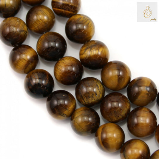 Natural yellow tiger's eye gemstone beads strand showing round 10mm beads with golden chatoyant bands