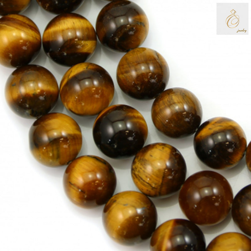 Natural yellow tiger's eye beads strand showing 16mm round gemstone beads with golden chatoyancy bands