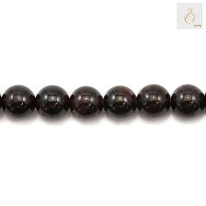 Red garnet gemstone beads arranged in a strand, perfect for DIY jewelry projects"
"Premium quality natural garnet beads, round shape, ideal for necklaces and bracelets