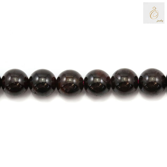 Red garnet gemstone beads arranged in a strand, perfect for DIY jewelry projects"
"Premium quality natural garnet beads, round shape, ideal for necklaces and bracelets