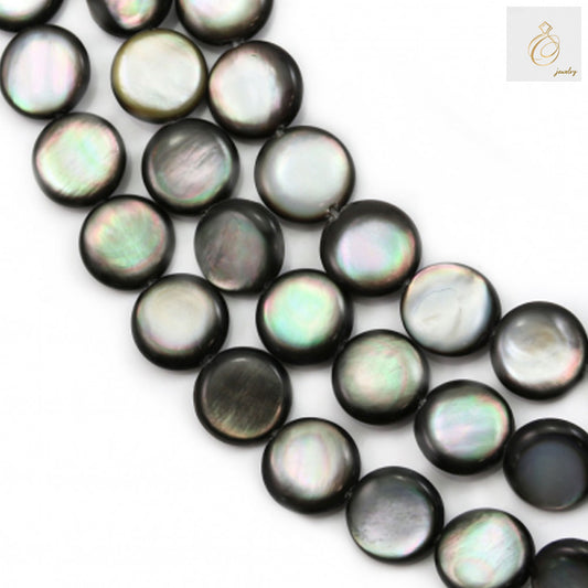 Close-up view of natural grey mother of pearl shell beads showing flat round shape and lustrous surface finish