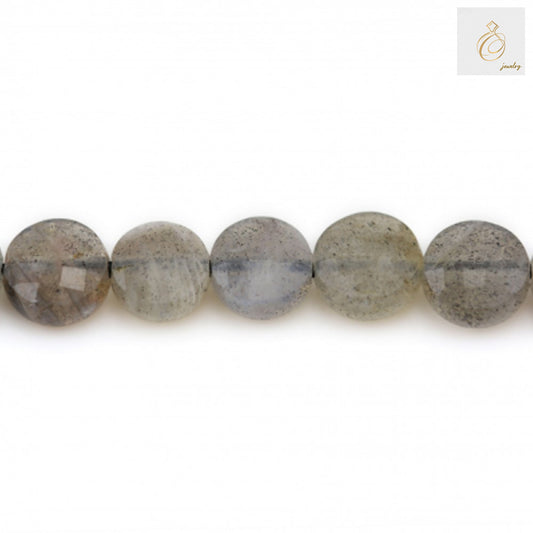Natural labradorite bead strand 6mm faceted flat round gemstones with 1mm holes arranged in line showing natural color variations and labradorescence