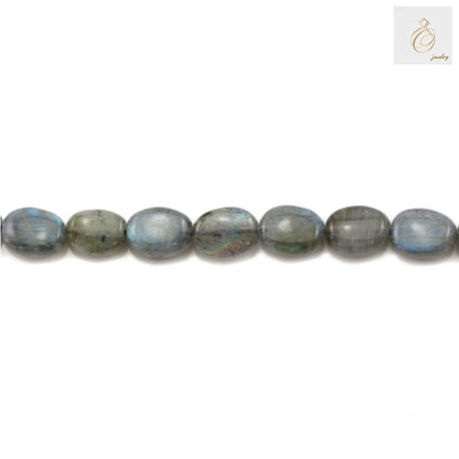 "Close-up view of natural labradorite oval beads showing color variations and quality"
