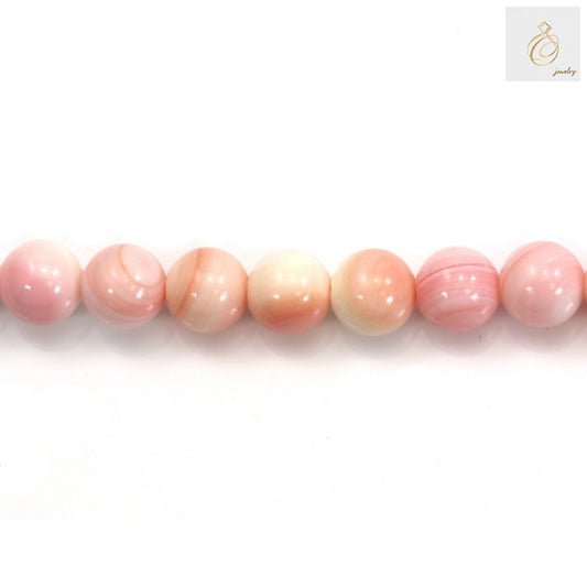 Natural pink mother of pearl shell beads strand showing lustrous round 10mm beads with smooth finish