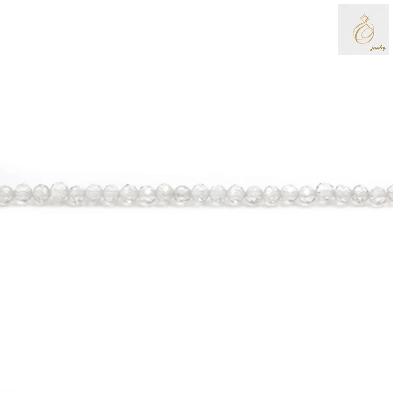 Close-up view of natural rock crystal beads displaying the precise 2mm diameter and faceted cut quality