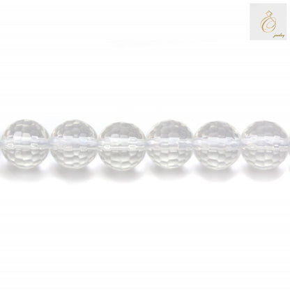 Close-up view of 6mm natural rock crystal beads displaying precise faceted cuts and uniform round shape