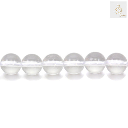 Close-up view of natural rock crystal beads displaying the transparent clarity and round shape of 10mm gemstone beads for DIY jewelry projects