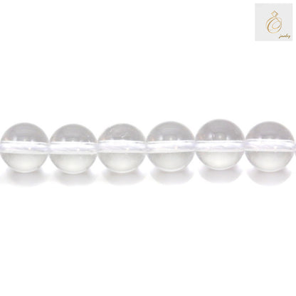Close-up view of natural rock crystal beads showing transparency and quality, 12mm diameter gemstone beads for crafting
