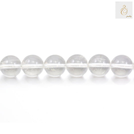Close-up view of natural rock crystal beads showing clarity and round shape, 14mm size