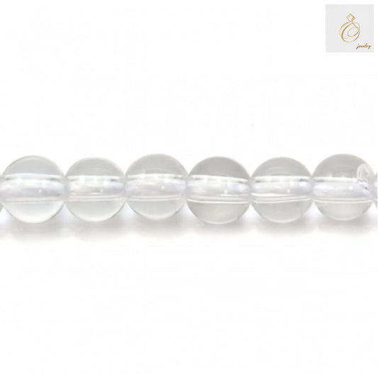 Close-up view of natural rock crystal beads showing clarity and round shape, 4mm diameter perfect for DIY jewelry projects