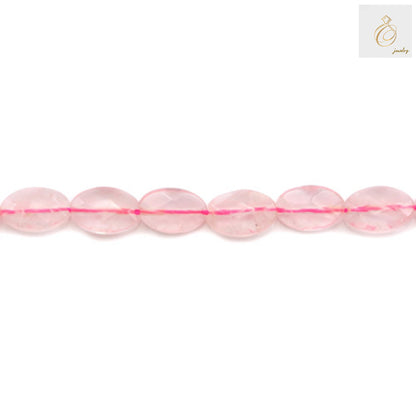 "Close-up view of Natural Rose Quartz Beads showing faceted oval shape and pink color"