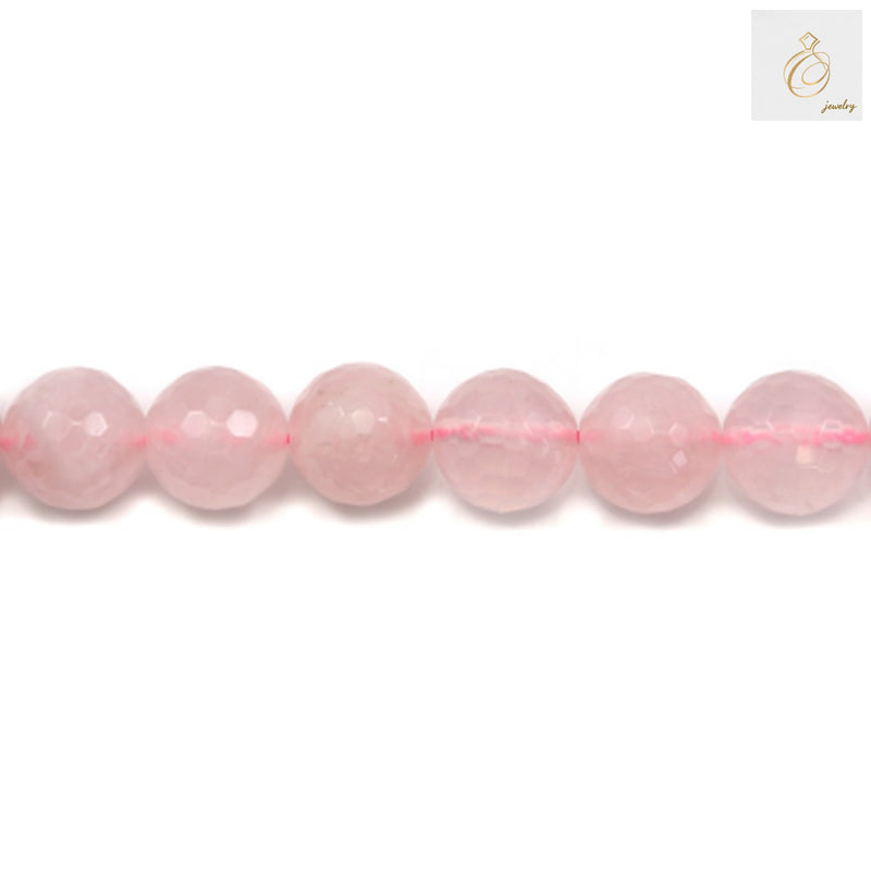 Close-up view of natural rose quartz beads strand displaying the translucent pink color and precision faceted cuts
