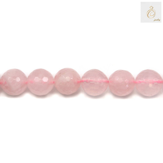 Close-up view of natural rose quartz beads strand displaying the translucent pink color and precision faceted cuts