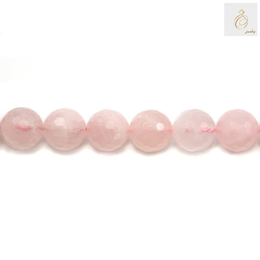 Close-up view of natural rose quartz beads strand displaying the translucent pink color and faceted surface detail