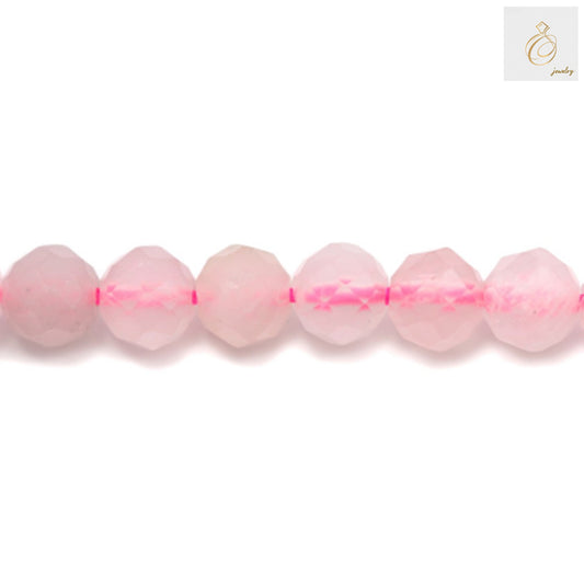 Close-up view of natural rose quartz beads showing faceted round cut and pink translucent color, 4mm diameter jewelry making supplies