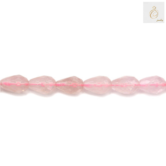 Close-up view of natural rose quartz teardrop beads displaying the smooth faceted surface and consistent 8x12mm sizing with 1mm holes