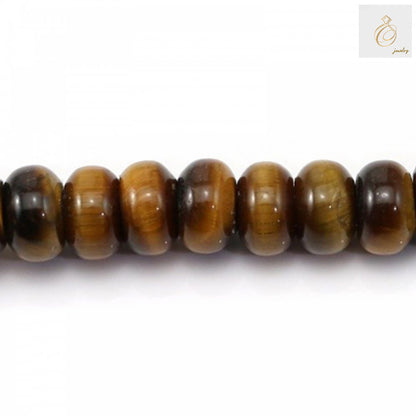 Close-up view of natural tiger's eye abacus beads displaying the characteristic golden bands and silky luster of the gemstone