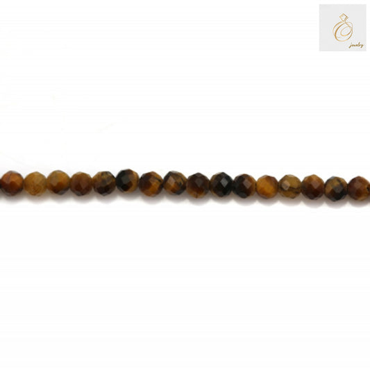 Close-up view of 2mm natural tiger's eye beads showing faceted surface and natural golden striped pattern, jewelry crafting supplies