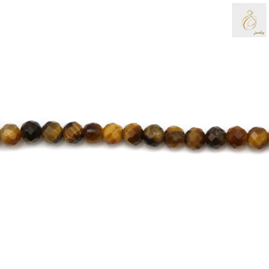 Close-up view of natural tiger's eye gemstone beads showing faceted surface and distinctive golden striped pattern