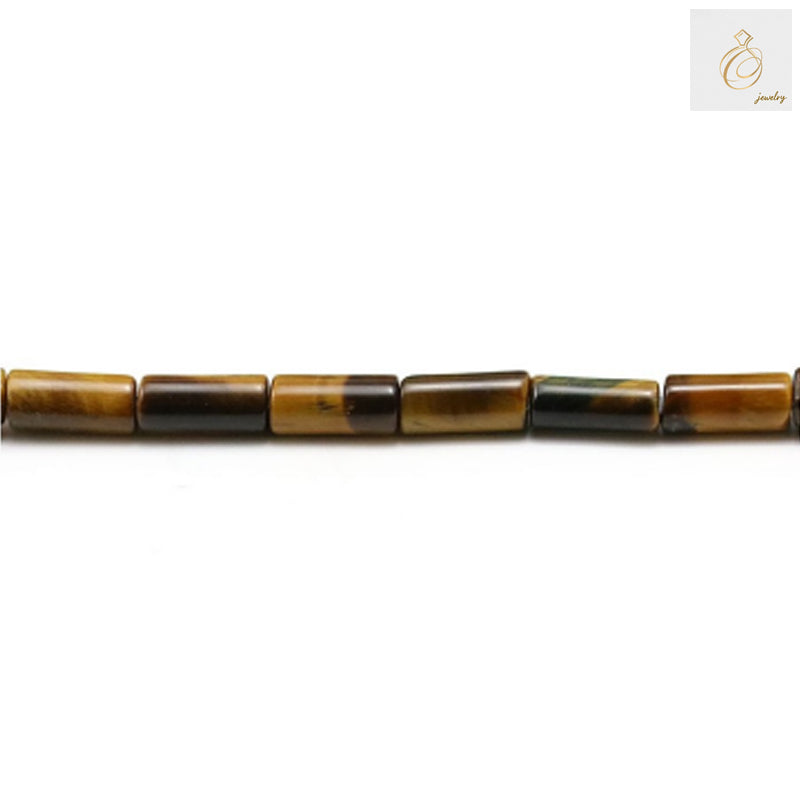 Close-up view of natural tiger's eye tube beads displaying the distinctive golden striped pattern and smooth cylindrical shape