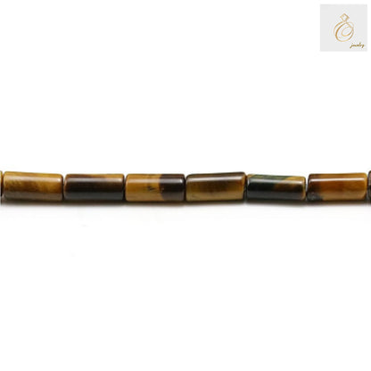 Close-up view of natural tiger's eye tube beads displaying the distinctive golden striped pattern and smooth cylindrical shape