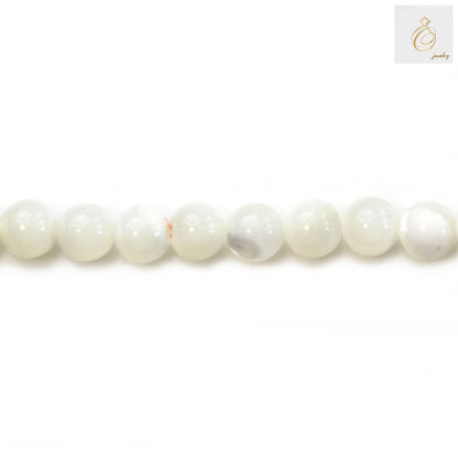 Natural white mother-of-pearl shell round beads 6mm diameter strand showing lustrous finish and uniform size